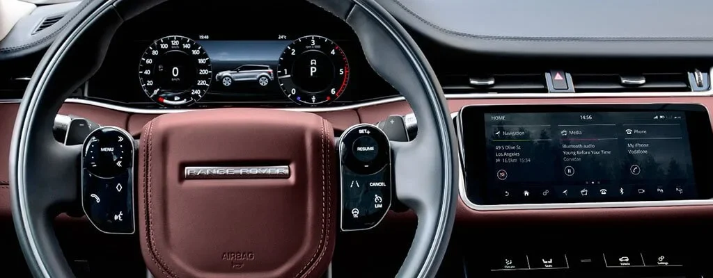 Range Rover dashboard with infotainment screen and steering-wheel controls