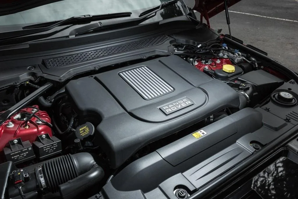 Range Rover engine bay with engine cover and intake components visible